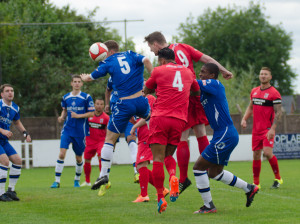 Graeme Armstrong heads the first goal at Halesowen