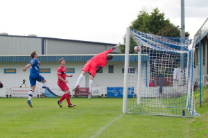 Kevin Burgess' header is on its way into the net