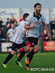 Adam Nowakowski celebrates after scoring the equaliser