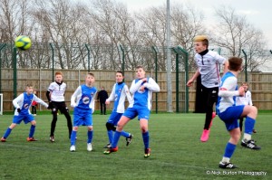 Corbyn Mitchell heads towards goal