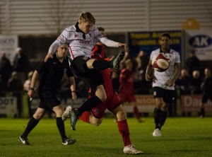 Adam Mitchell clears the ball away from Danger
