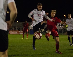 Nathan Cartman challenges for the ball with former Darlo player Ricky Ravenhill