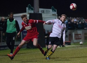 Nathan Cartman challenges for the ball with Stamfords Ollie Luto (1 of 1)
