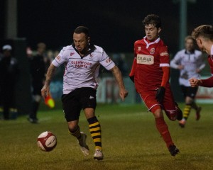 Stephen Thompson takes the ball forwards shadowed by Stamfords Jordan Smith (1 of 1)