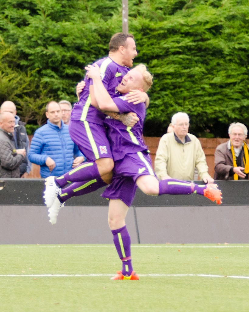 Liam Marrs congratulates Stephen Thompson after scoring at Harrogate