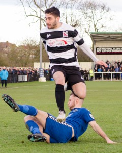 Josh Gillies hurdling a Curzon defender's 