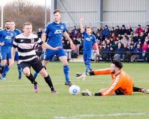 Curzon Keeper beating Darlo's new boy, David Ferguson to the ball.