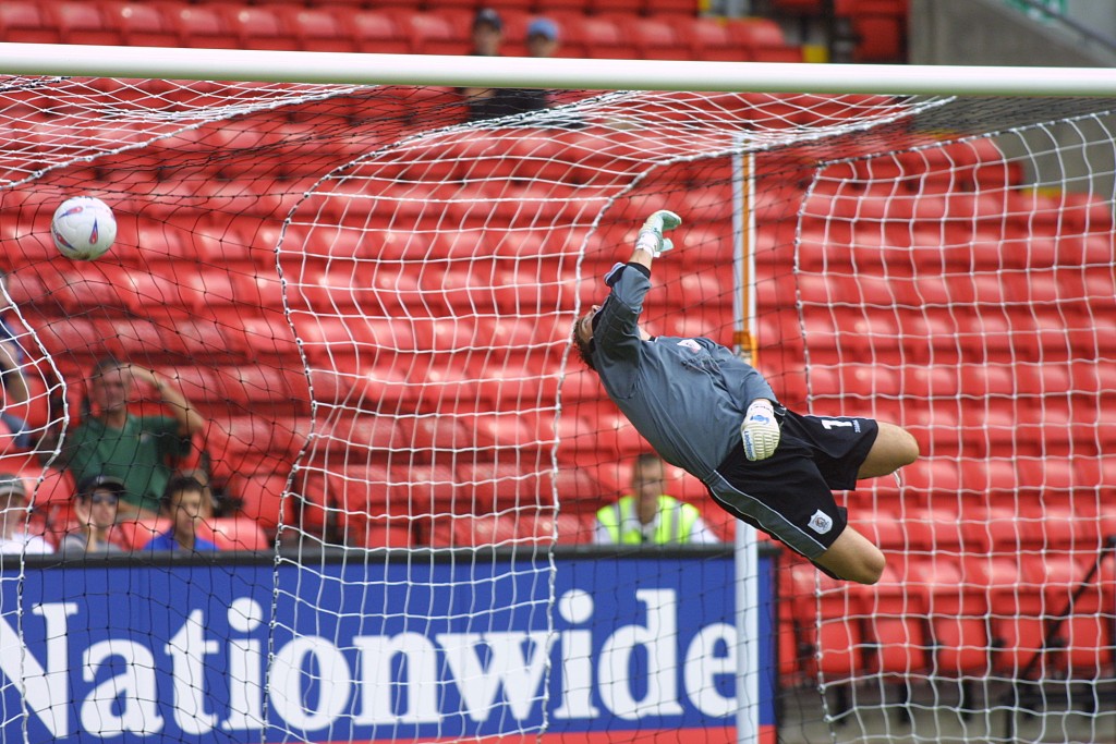 DARLINGTON V KIDDERMINSTER HARRIERS - THE FIRST GOAL SCORED AT THE REYNOLDS ARENA AS THE BALL SAILS PASSED DARLINGTON KEEPER ANDY COLLETT - D16/08/03CT