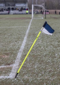The corner flag takes a battering in the wind