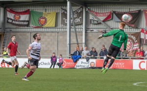 FC United Keeper comes out of his area but heads the ball backwards