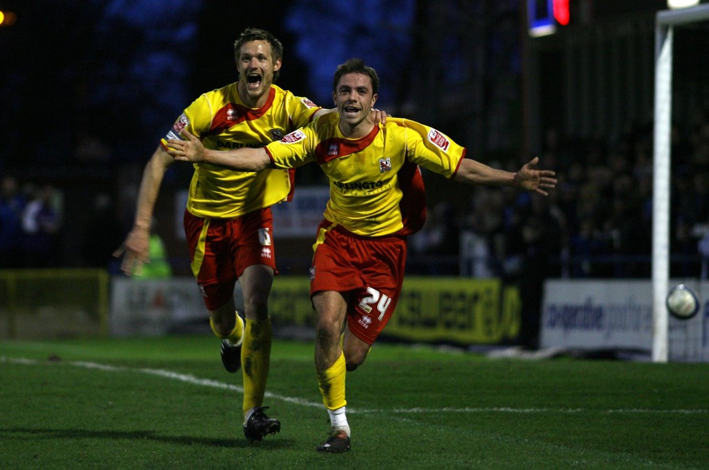 Nathan Mulligan (right) celebrates scoring for Darlington in the first half.
