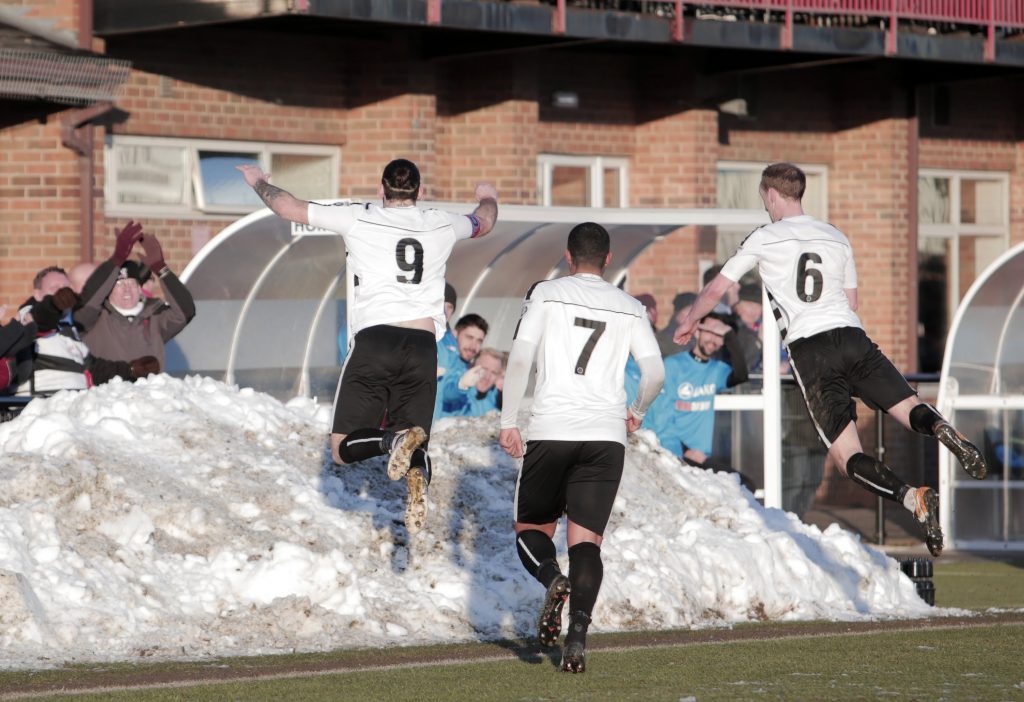 Reece Styche dives head first into a snowdrift. Photograph: Stuart Boulton