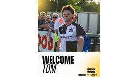 Tom Henson signs for the Quakers
