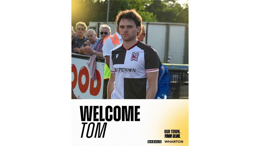 Tom Henson signs for the Quakers