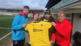 Staunch Darlington fans presented with a signed shirt