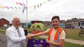Quakers present a signed shirt to Firthmoor Community Centre