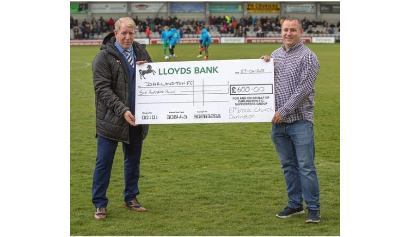 Embrace Church present £600 cheque to DFC